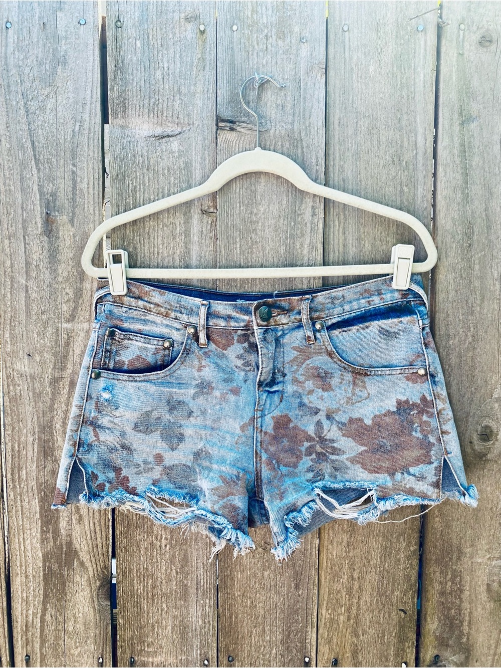 Free People Floral Distressed Denim Shorts in Blue and Brown